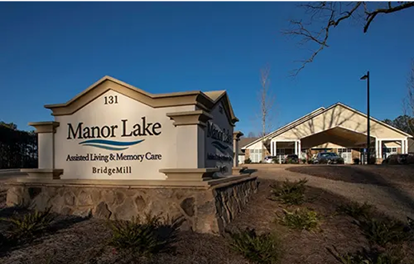 Manor Lake Assisted Living & Memory Care facility entrance with sign in BridgeMill neighborhood
